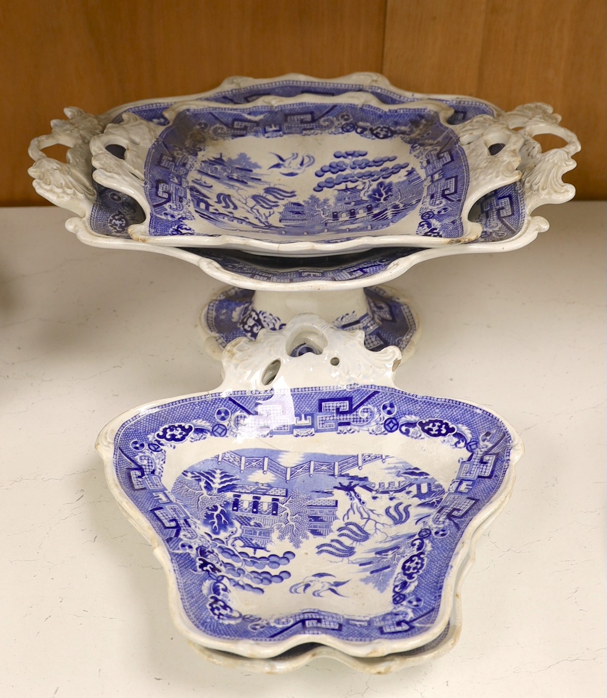 An early 19th century pearlware part dessert set - comport and three shaped dishes, comport 36cms wide